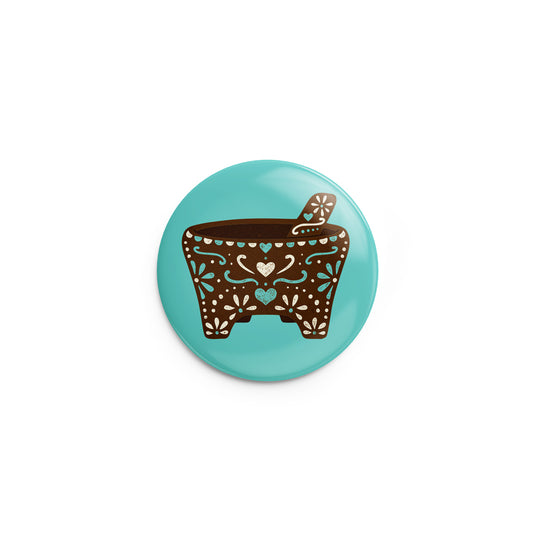 turquoise pin-back button mockup of a mexican molcajete